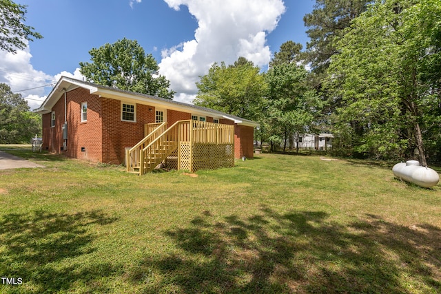 view of yard featuring a wooden deck