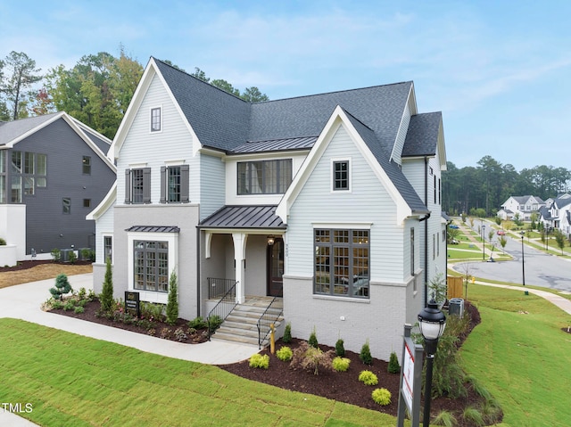 view of front of property with cooling unit and a front lawn