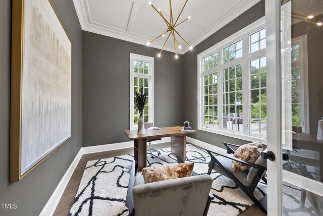 home office with an inviting chandelier, hardwood / wood-style flooring, a healthy amount of sunlight, and crown molding