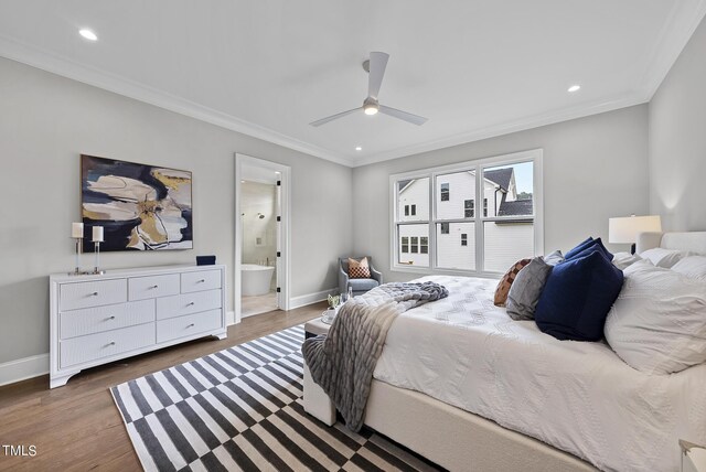 bedroom with ceiling fan, hardwood / wood-style flooring, crown molding, and ensuite bathroom