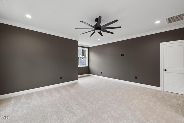 unfurnished room featuring ceiling fan, light carpet, and ornamental molding