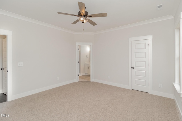 unfurnished room featuring visible vents, ornamental molding, light carpet, ceiling fan, and baseboards