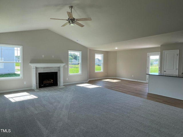 unfurnished living room with a fireplace, plenty of natural light, and hardwood / wood-style floors