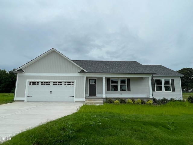 ranch-style house with a garage and a front yard