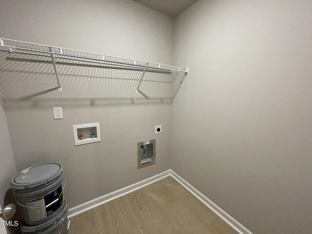 laundry room with electric dryer hookup, washer hookup, and hardwood / wood-style floors