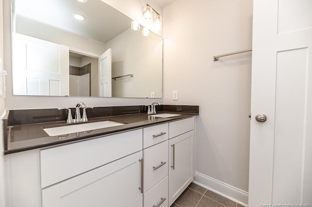 bathroom with tile floors and dual vanity