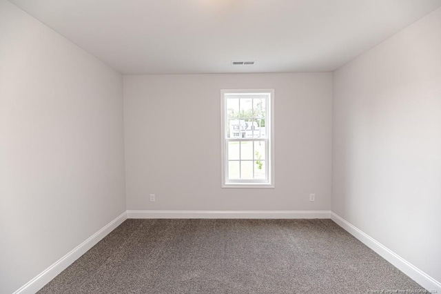 unfurnished room featuring carpet flooring