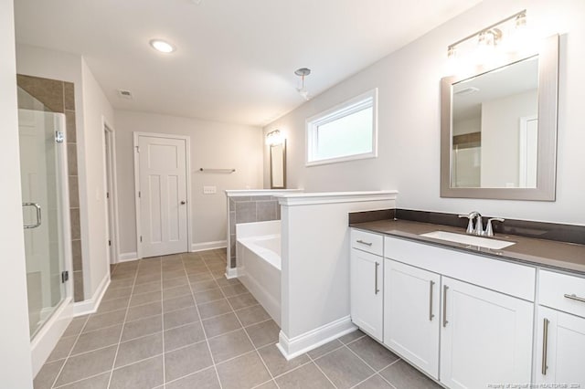 bathroom featuring tile flooring, plus walk in shower, and large vanity