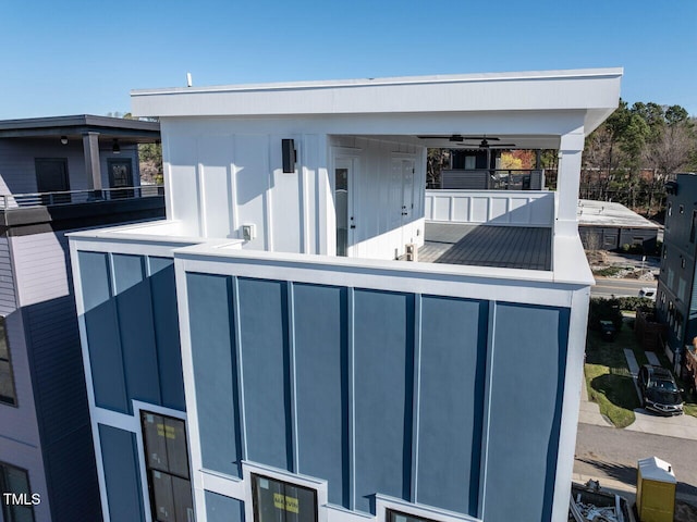 exterior space featuring a balcony and ceiling fan