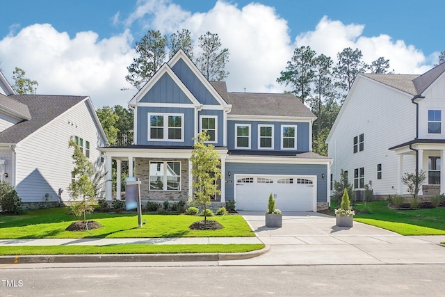 craftsman inspired home with a garage and a front yard