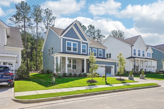 craftsman-style house with a garage and a front yard