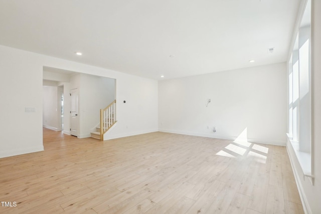 unfurnished room with light hardwood / wood-style flooring