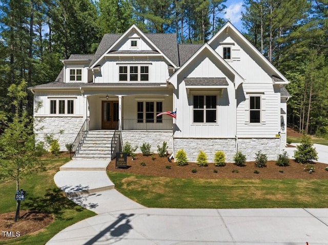 view of front facade with a front lawn and a porch