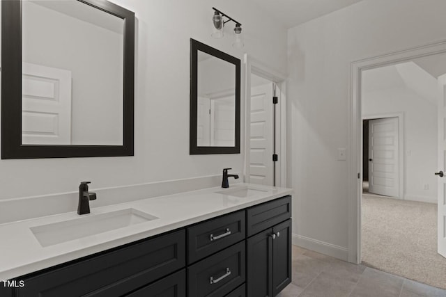 bathroom featuring tile patterned flooring and vanity