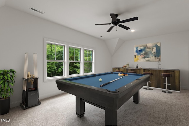 rec room featuring ceiling fan, billiards, indoor wet bar, light colored carpet, and vaulted ceiling