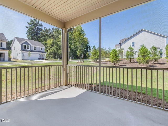 unfurnished sunroom featuring a residential view