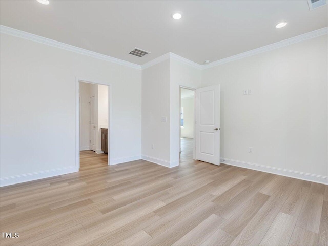 unfurnished bedroom with ornamental molding, light wood-type flooring, and baseboards