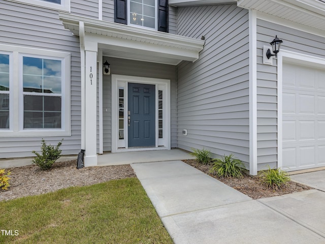 property entrance with an attached garage