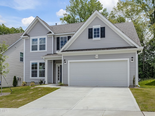 traditional-style home with concrete driveway, roof with shingles, and a front yard