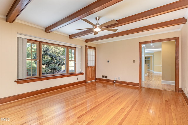 spare room with ceiling fan, light hardwood / wood-style flooring, ornamental molding, and beamed ceiling