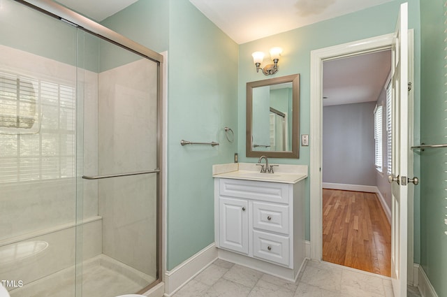 bathroom with vanity and an enclosed shower