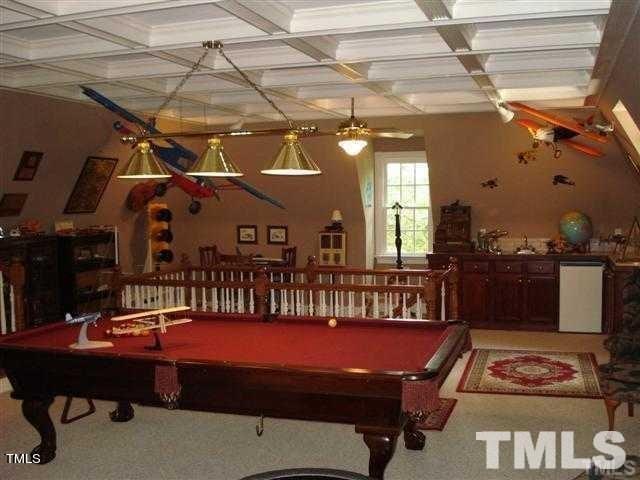 rec room with coffered ceiling, pool table, beamed ceiling, and carpet floors