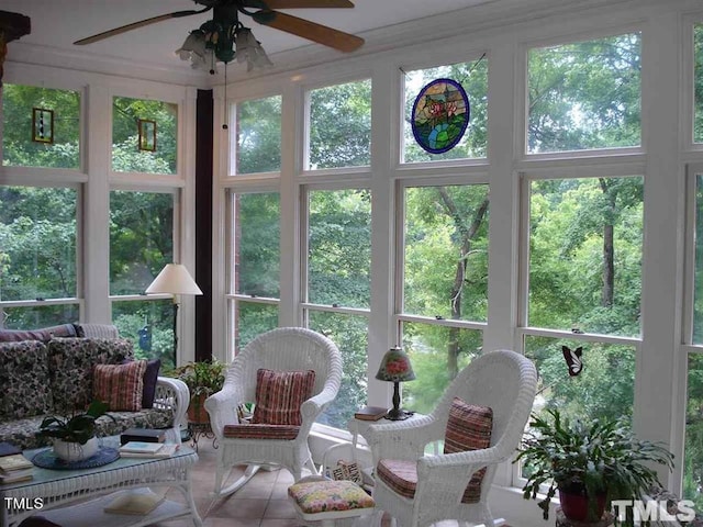 sunroom featuring ceiling fan