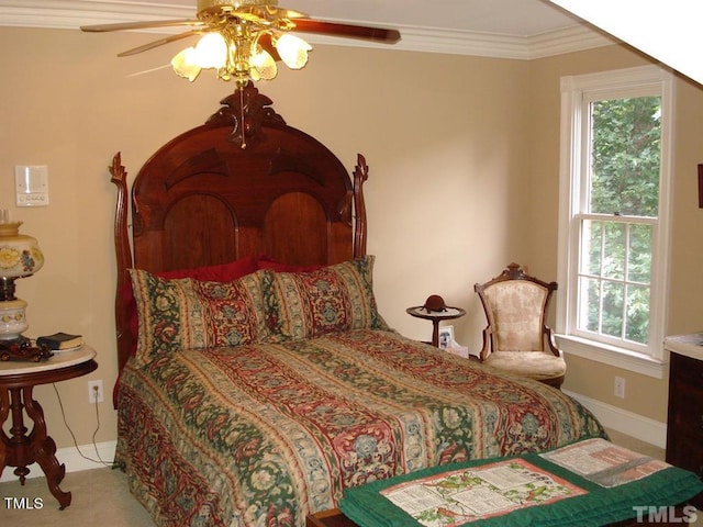 carpeted bedroom with crown molding, ceiling fan, and multiple windows