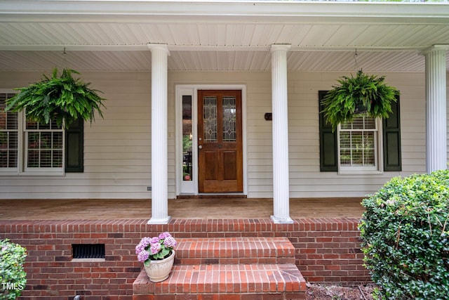 property entrance with covered porch