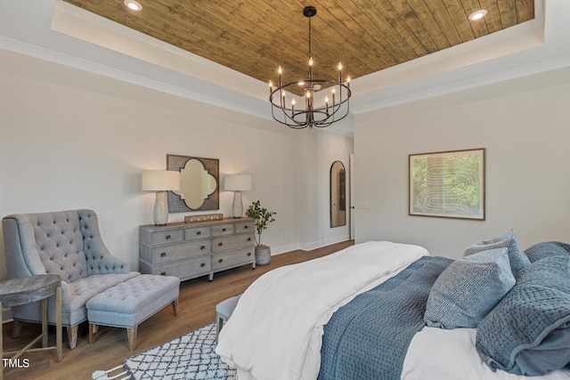 bedroom with a raised ceiling, wood ceiling, crown molding, hardwood / wood-style flooring, and an inviting chandelier