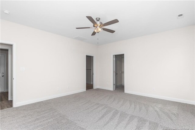 unfurnished room featuring carpet and ceiling fan