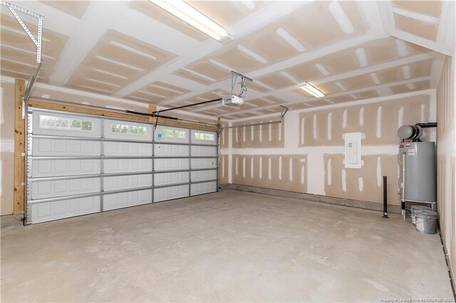 garage with water heater and a garage door opener