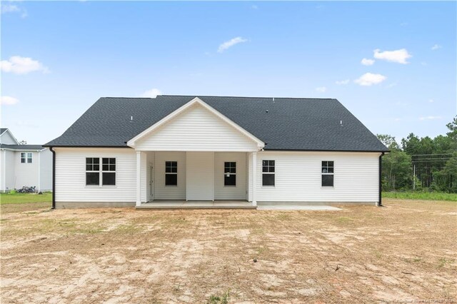 back of house with a patio