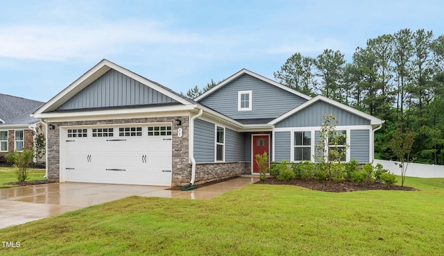 craftsman house featuring a front yard and a garage