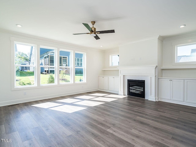 unfurnished living room featuring ceiling fan, crown molding, and hardwood / wood-style floors