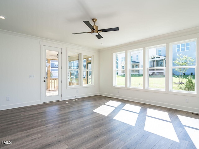 unfurnished room with a wealth of natural light and hardwood / wood-style flooring