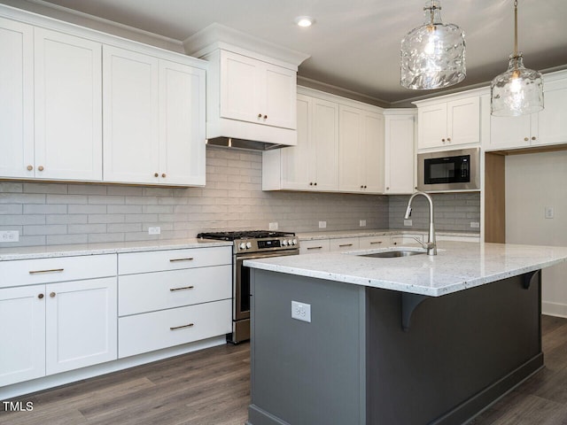 kitchen featuring decorative backsplash, black microwave, dark hardwood / wood-style floors, sink, and stainless steel range with gas stovetop