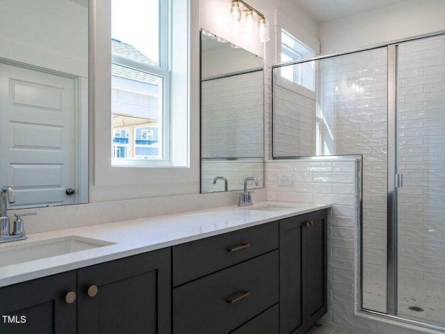 bathroom featuring tile walls, a shower with door, and vanity