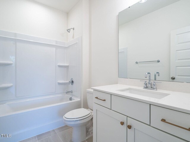 full bathroom with toilet, vanity, bathtub / shower combination, and tile patterned floors