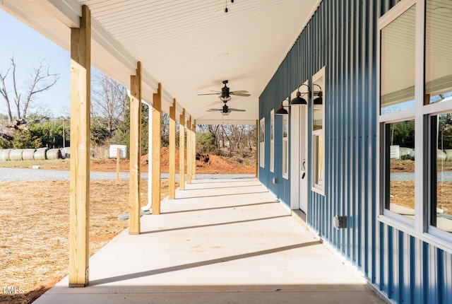 view of patio / terrace with ceiling fan and a porch