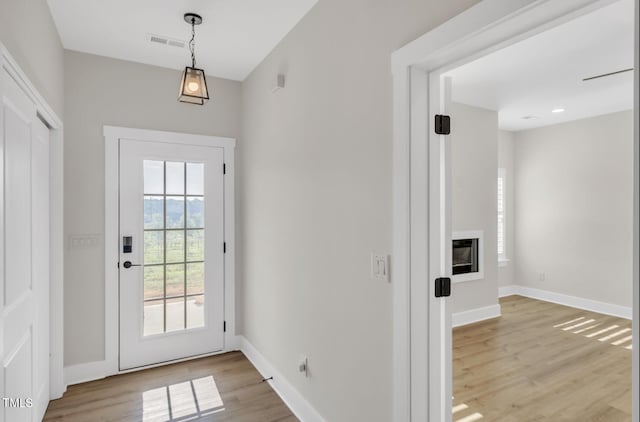 doorway to outside featuring light hardwood / wood-style floors