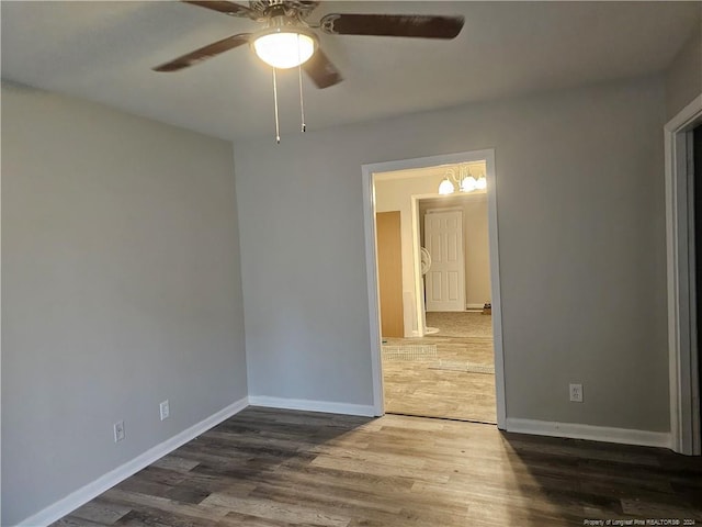 unfurnished room with hardwood / wood-style flooring and ceiling fan