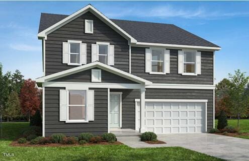 view of front of house featuring a front yard and a garage