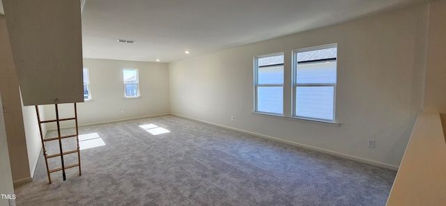 unfurnished room with carpet flooring