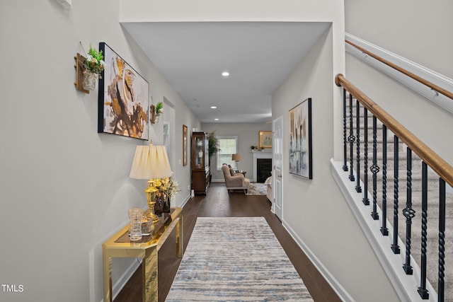 corridor with dark hardwood / wood-style floors