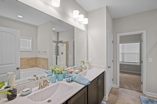 bathroom featuring a wealth of natural light, tile flooring, separate shower and tub, and vanity