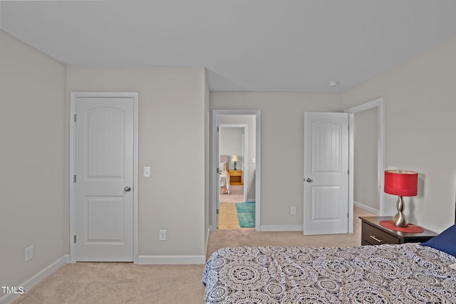 bedroom with light carpet