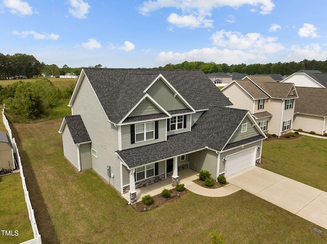 craftsman-style home with a front lawn