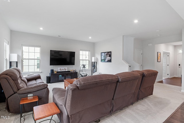 living room with light hardwood / wood-style flooring and plenty of natural light