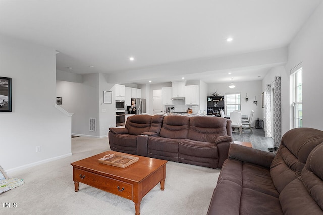 living room with light colored carpet